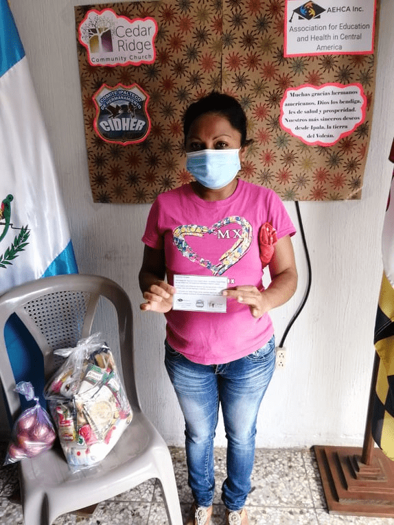 Woman getting food bundle