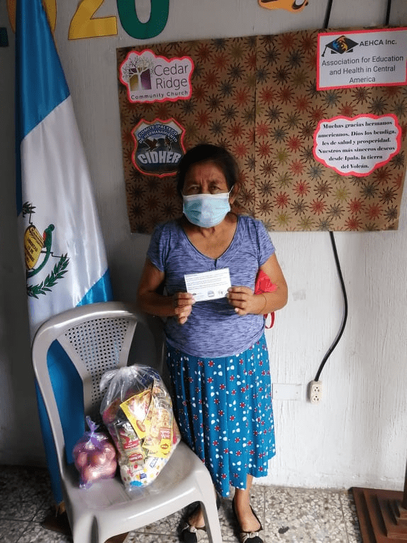 Woman getting food bundle