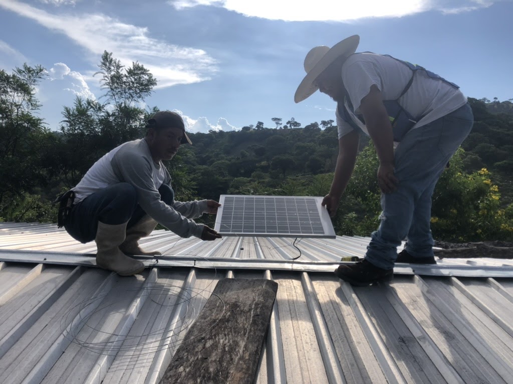 working on installing solar panels